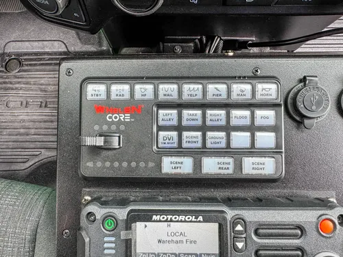 Rear cabin view showing front seats, center console, and dashboard.